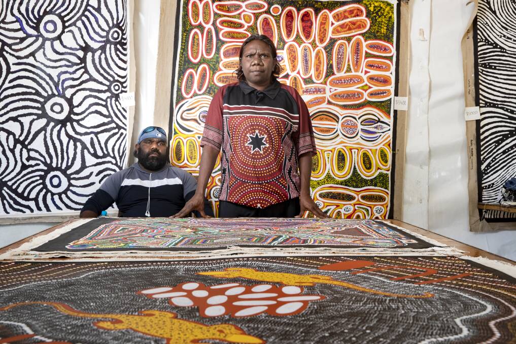 Artists Ralphie Dixon and Matrina Nangala Robertson came from the remote community of Lajamanu in the Northern Territory to sell their work at the Indigenous Arts Market in Acton. Photo: Sitthixay Ditthavong