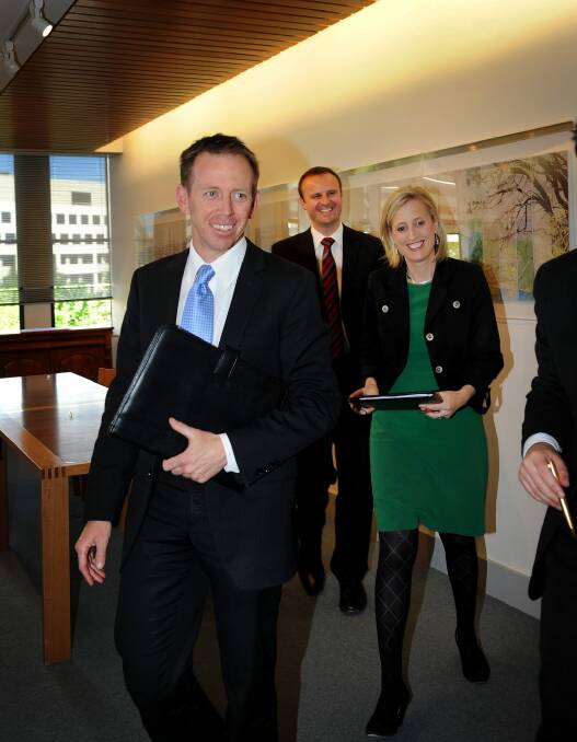 Shane Rattenbury after signing the power-sharing agreement in 2012, with Andrew Barr and Katy Gallagher in the background. Photo: Colleen Petch