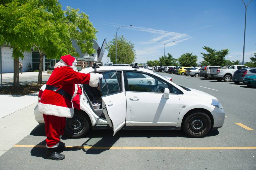 Santa will be sweaty in his red suit in Canberra on Sunday.  Photo: Jay Cronan