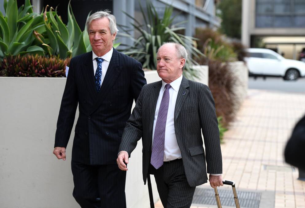 Lawyers for Ardent Leisure Bruce Hodgkinson SC (right) and James Bell QC arrive for the inquest into the Dreamworld disaster at the Magistrates Court at Southport in June. Photo: AAP