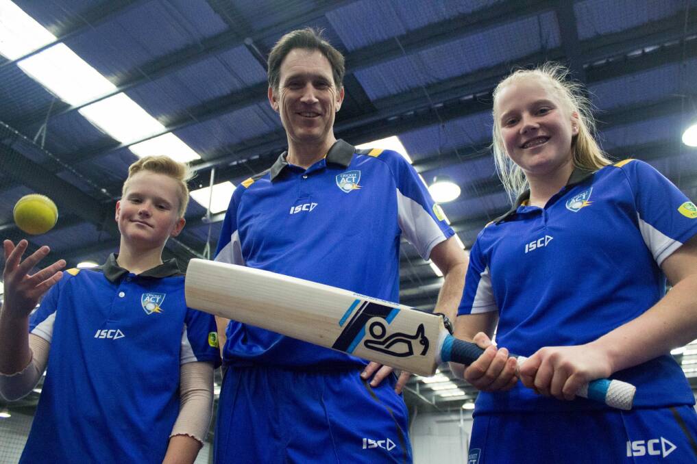 Cricket Australia CEO James Sutherland with Lauren Phillips (15) and Matt Phillips (12) in Canberra during Play Cricket Week. Photo: Cricket Australia