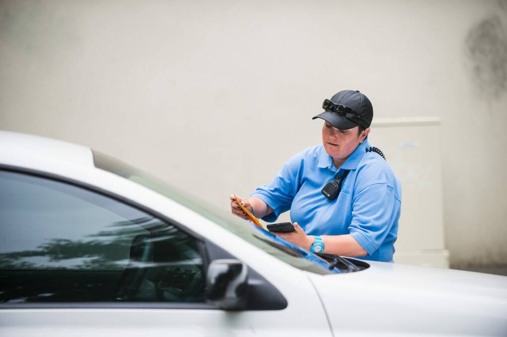 An ACT parking inspector leaves a ticket on the windscreen of a car in Civic in February. 


4 Feb 2015
Photo: Rohan Thomson
The Canberra Times Photo: Rohan Thomson