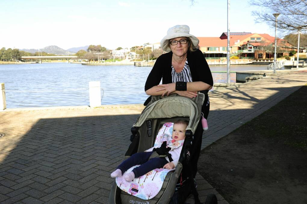 Emmy Yager of Isabella Plains with her daughter Phoebe at Lake Tuggeranong. Photo: Melissa Adams