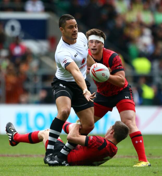 Adjusting to yet another new sport: Jarryd Hayne offloads during the pool round match between Fiji and Wales during the London Sevens at Twickenham Stadium. Photo: Getty Images 