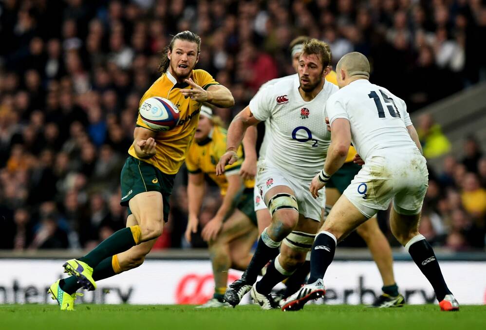 Rob Horne draws in two defenders to release Bernard Foley to score the Wallabies' opening try. Photo: Getty Images