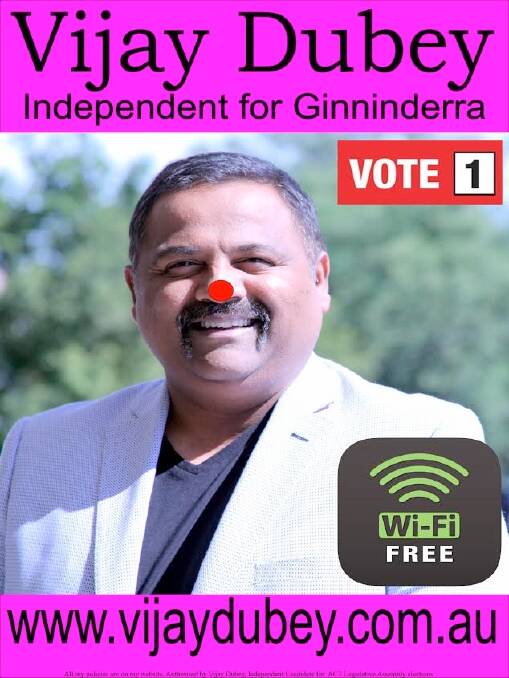Independent candidate for Ginninderra Vijay Dubey with his election poster. And, yes, the red dot is meant to be there. Photo: Supplied