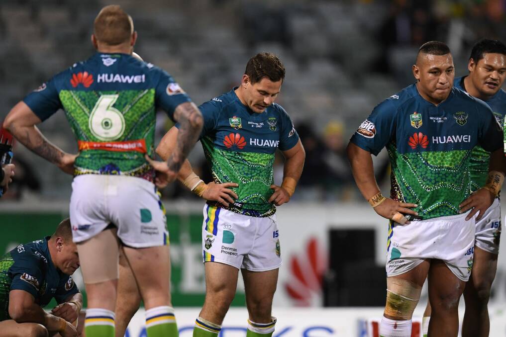 Dejected Raiders halves Blake Austin and Aidan Sezer after Canberra's loss to the Cowboys. Photo: AAP