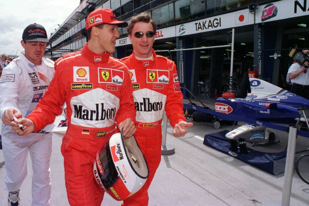 Ferrari drivers Michael Schumacher and Eddie Irvine at the Melbourne Grand Prix in 1998. Photo: AP