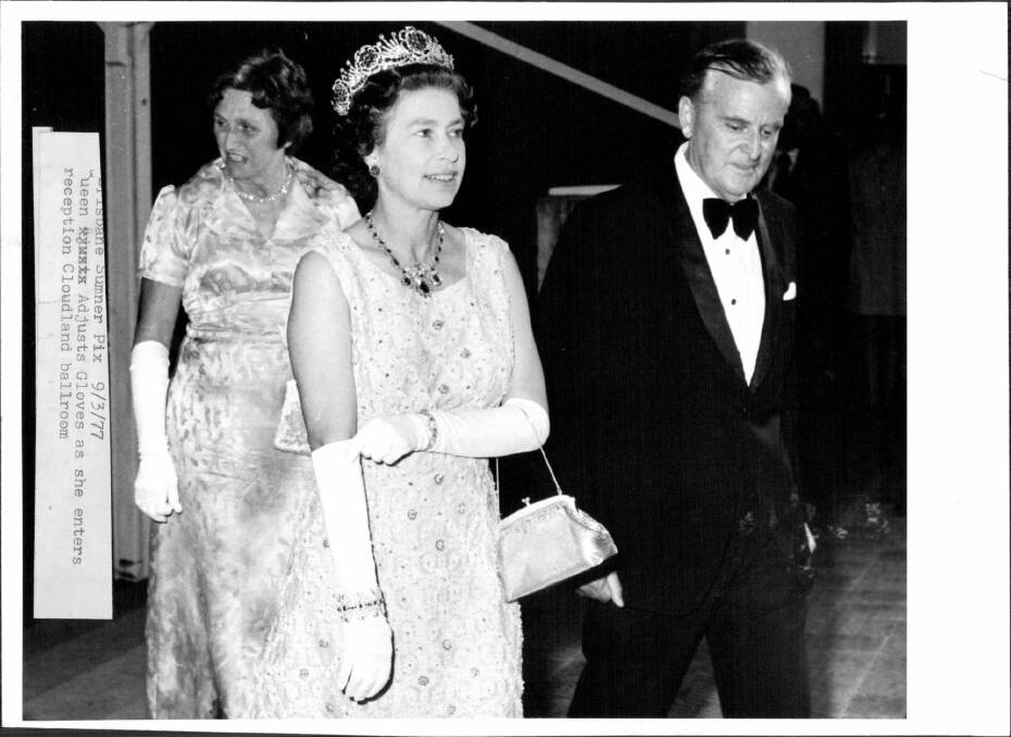 Queen adjusts Gloves as she enters reception Cloudland ballroom. March 09, 1977. Photo: Victor Colin Sumner/Fairfax Media