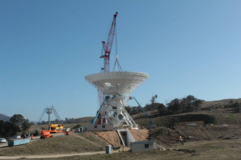 The Deep Space Station 36 antenna dish is lifted into place on Thursday. Photo: Canberra Deep Space Communicatio