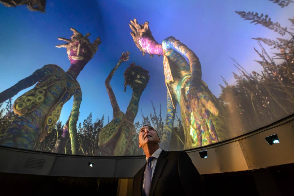 National Museum of Australia director Mathew Trinca immerses himself inside DomeLab. Photo: Sitthixay Ditthavong