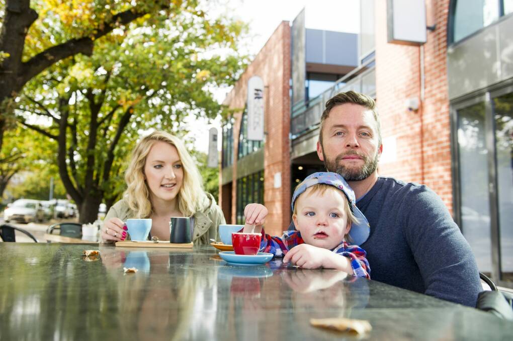 Damien Maher with his wife, Emma, and son, Harry, in Braddon.