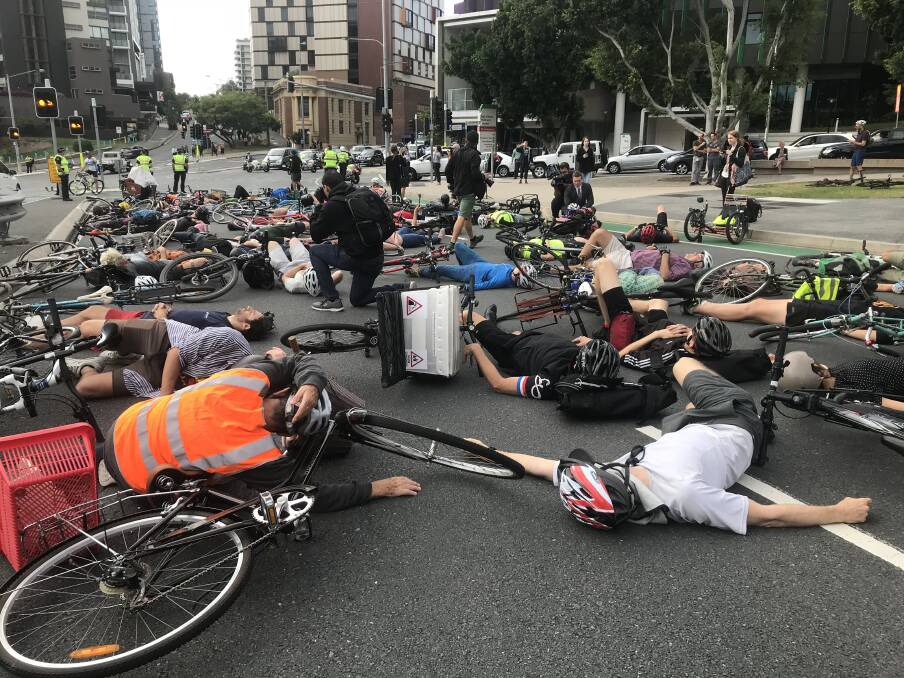 Cyclists staged a "die-in" protest during Brisbane's peak hour traffic on May 2.  Photo: Amy Mitchell-Whittington