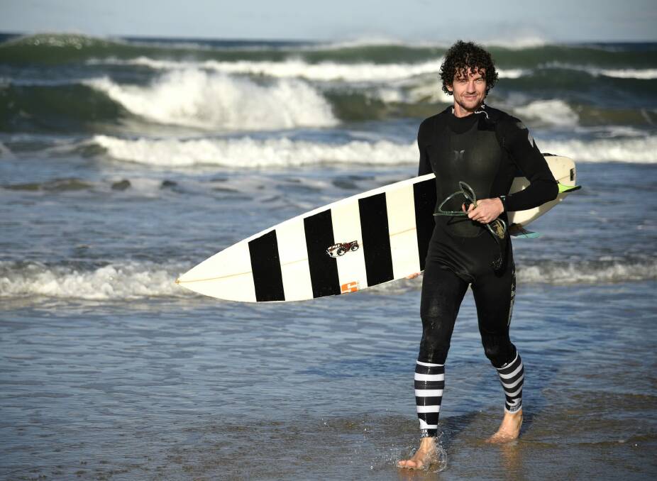 Canberra surfer Jeremy Kenny, one half of an entrepreneurial duo, wants to protect surfers, and sharks, with new products from Sharkstripes. Photo: Supplied