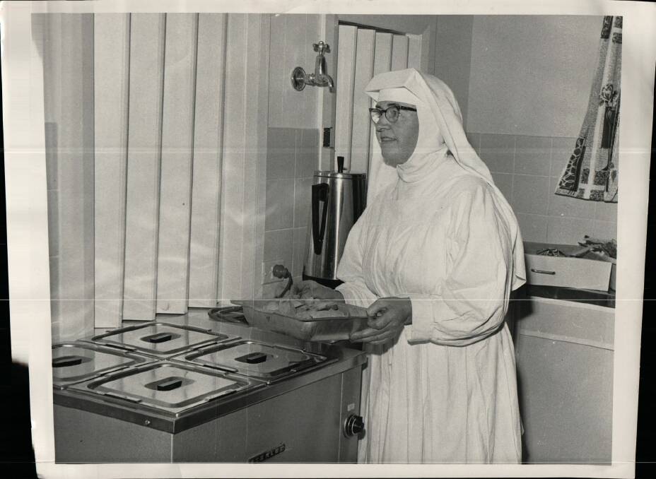 One of the sisters serves up a baked dinner in the early days of Marymead. Photo: Supplied