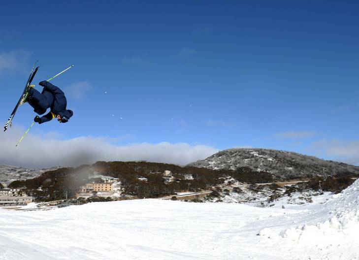 The official opening of the ski season at Perisher Blue. A skier gets some air over a jump on Front Valley. Photo: Graham Tidy GGT