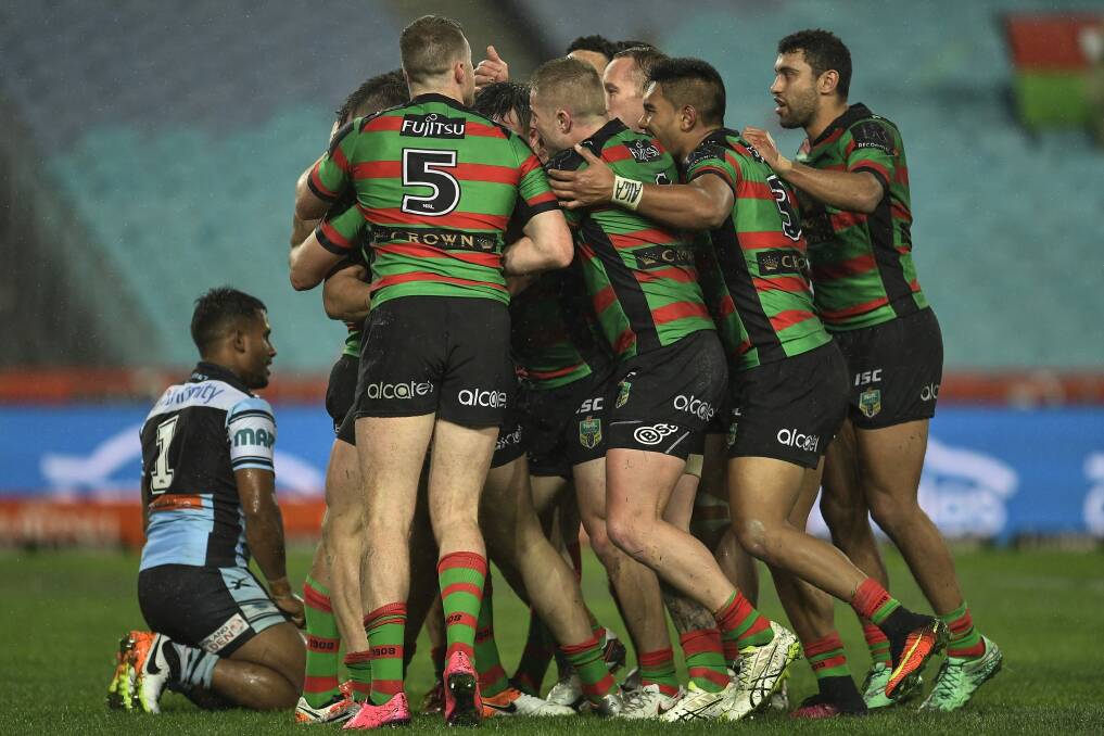 Bunnies boilover: South Sydney players celebrate during their win over Cronulla at ANZ Stadium. Photo: Brett Hemmings