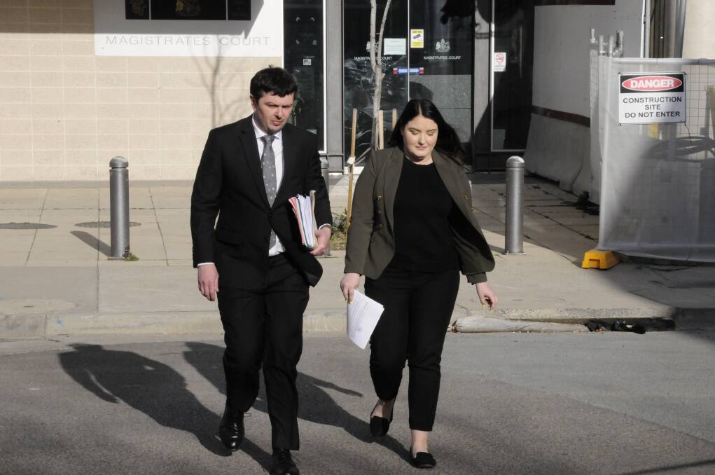 Convicted fraudster Taylor Jade Geoghegan leaves the ACT Magistrates Court with her lawyer, Michael Kukulies-Smith. Photo: Michael Inman