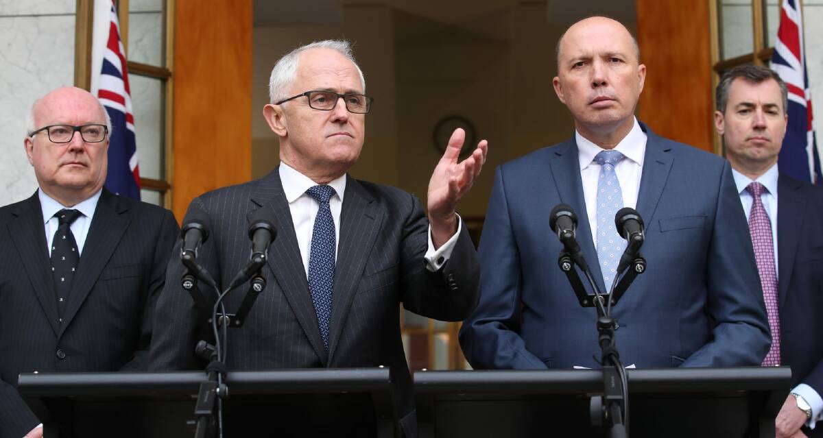 Questions of direction remain: Prime Minister Malcolm Turnbull announced Peter Dutton will become the Minister for Home Affairs at Parliament House in Canberra with Minister Michael Keenan and Attorney-General George Brandis. Photo: Andrew Meares