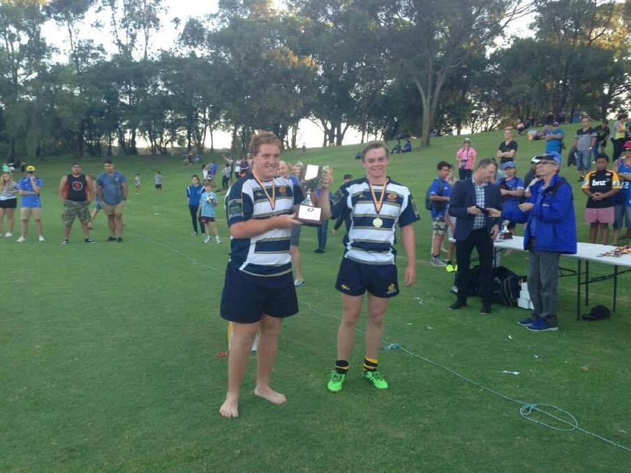 Brumbies under-17s captain Tom Ross and Ryan Lonergan with the Gold Cup trophy in Perth. Photo: Supplied