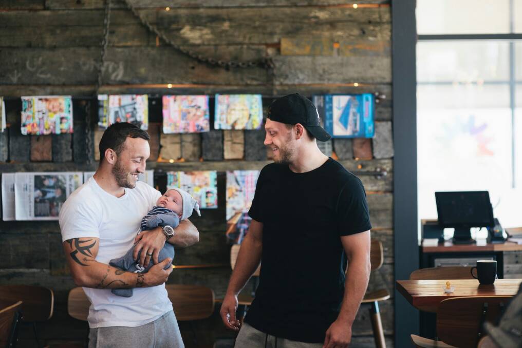 English imports Josh Hodgson (holding his son George) and Elliott Whitehead catch up for a coffee in Casey.