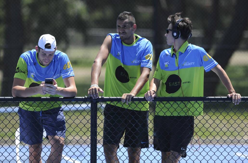 Nick Kyrgios is a spectator for one of the doubles matches.  Photo: Graham Tidy