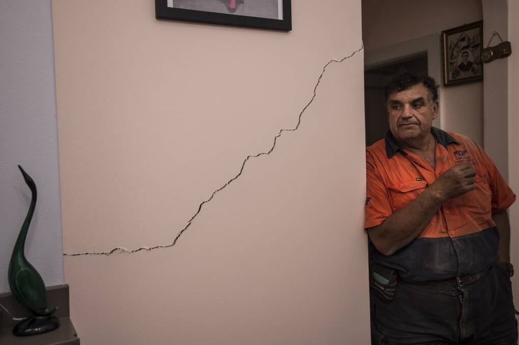Umberto Galasso pictured with a crack he says opened up or widened after excavation works for WestConnex beneath his North Strathfield home.  Photo: Wolter Peeters