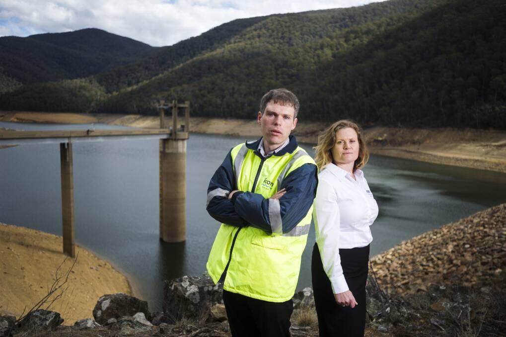 Icon Water senior analytics engineer Tim Purves and corporate affairs manager Bronwen Butterfield at Corin Dam which is currently at a third of its capacity. Photo: Dion Georgopoulos