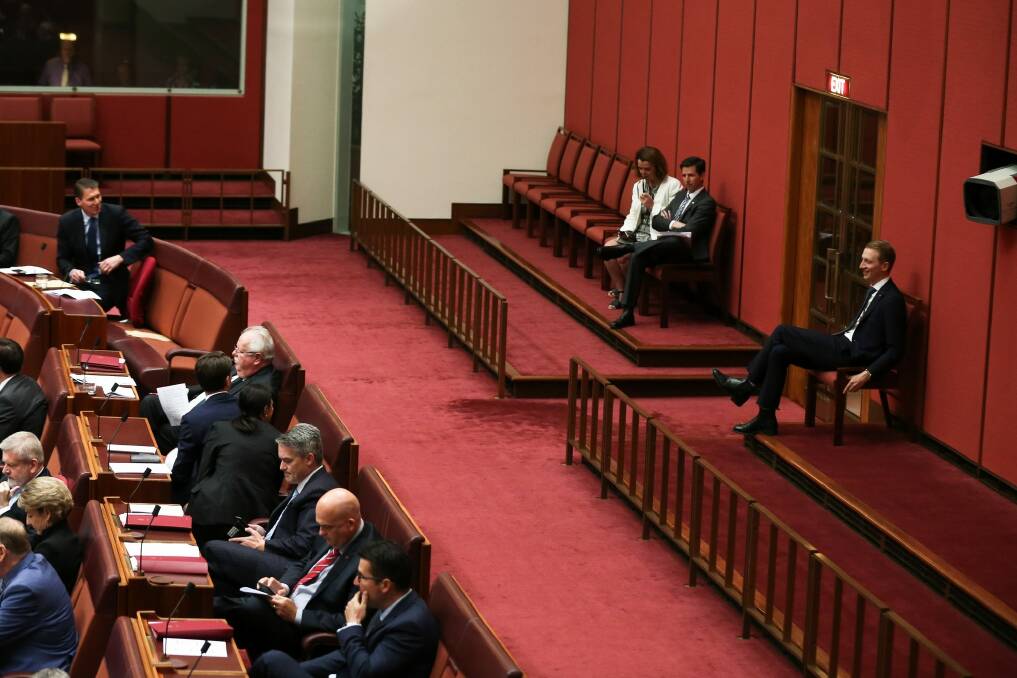Senator Cory Bernardi looks over his should as senators Anne Ruston, Simon Birmingham and James Paterson abstain during a division in the Senate. Photo: Alex Ellinghausen