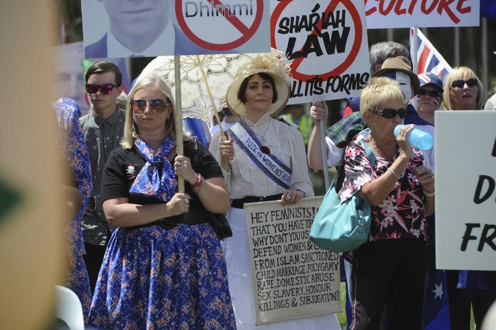 Arabella McKenzie protests dressed as a suffragete, Photo: Graham Tidy