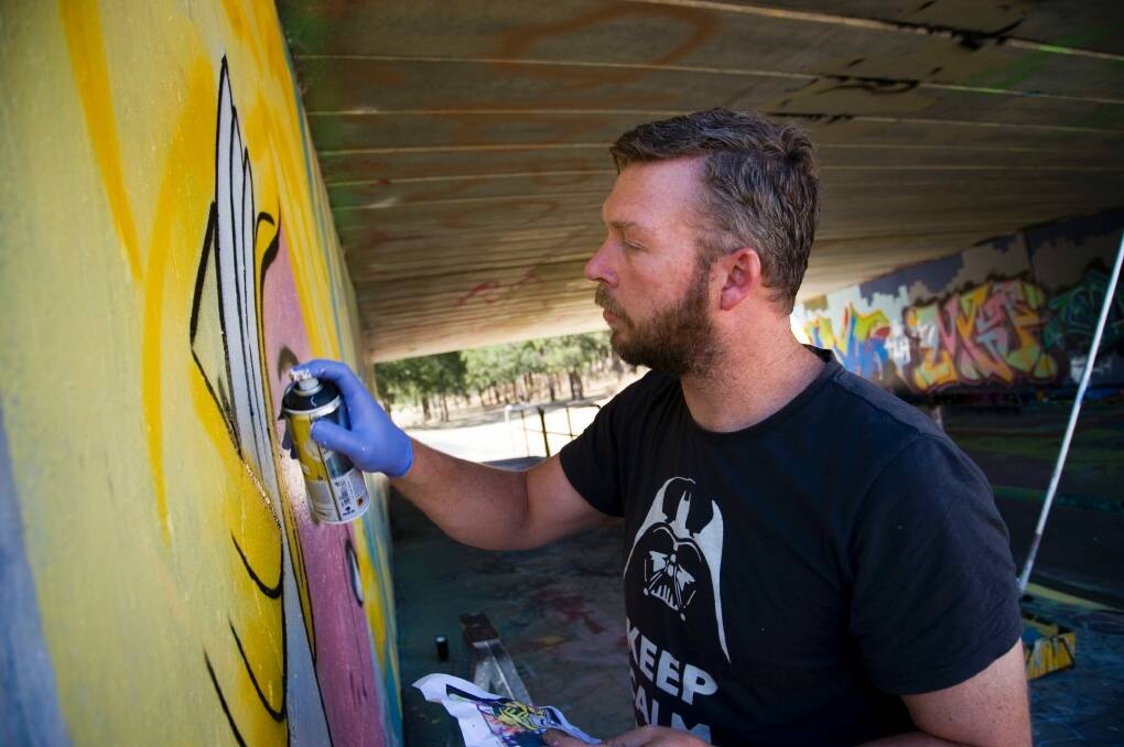 New life: Graffik Paint artist Geoff Filmer will paint several walls in Civic this summer to revitalise the area.  Photo: Elesa Kurtz
