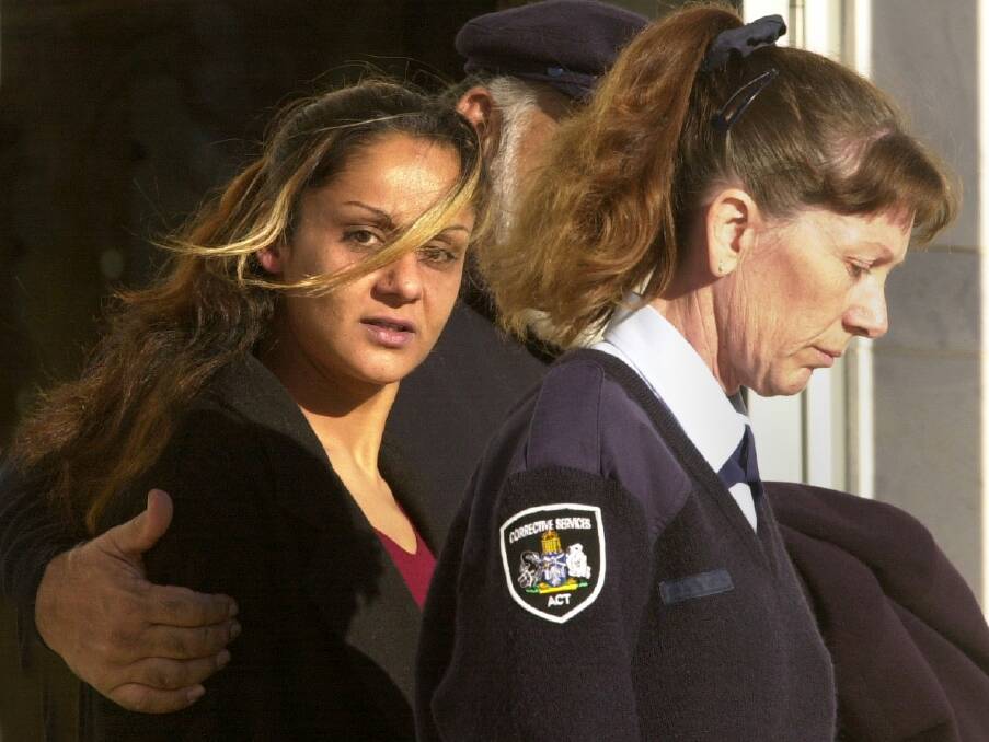 Anu Singh leaves the Supreme Court in 2004 with her father and a Corrective Services officer. Photo: Richard Briggs