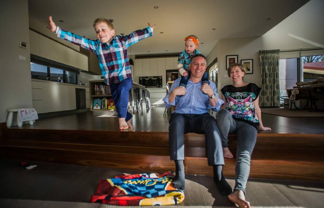The Steve family of Narrabundah, (from left) Alexander, 6, Oliver, 2, and Anthony and Clare will be wearing loud shirts on October 21 to help raise funds for those with hearing impairment. Photo: Karleen Minney