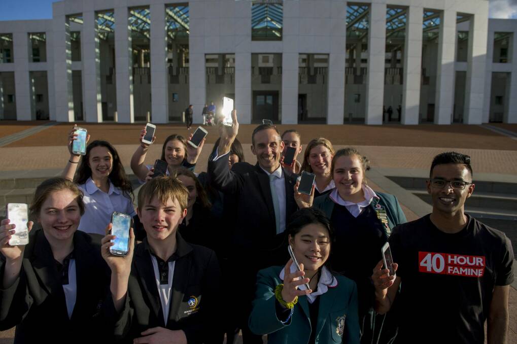 Member for Fraser Andrew Leigh, centre,  will be taking part in the 40 Hour Famine by giving up all use of his mobile phone and email along with students from Mount Stromlo High School, Canberra Girls Grammar and Gungahlin High School. Photo: Jay Cronan