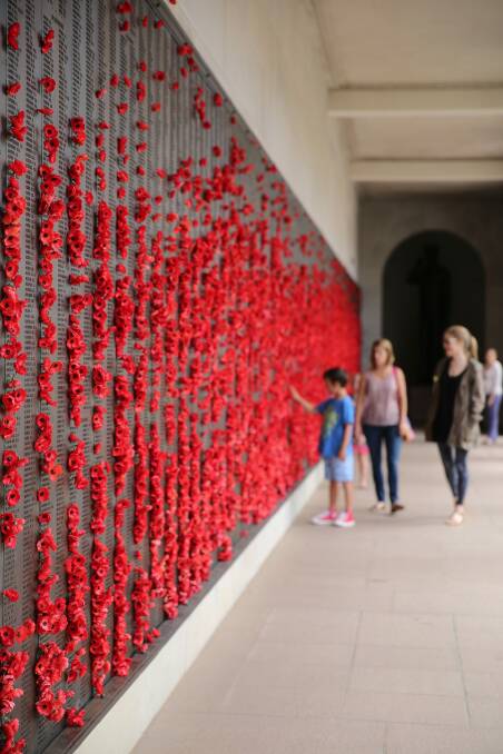 Visitors at the Roll of Honour at the Australian War Memorial. Photo: Daniel Spellman