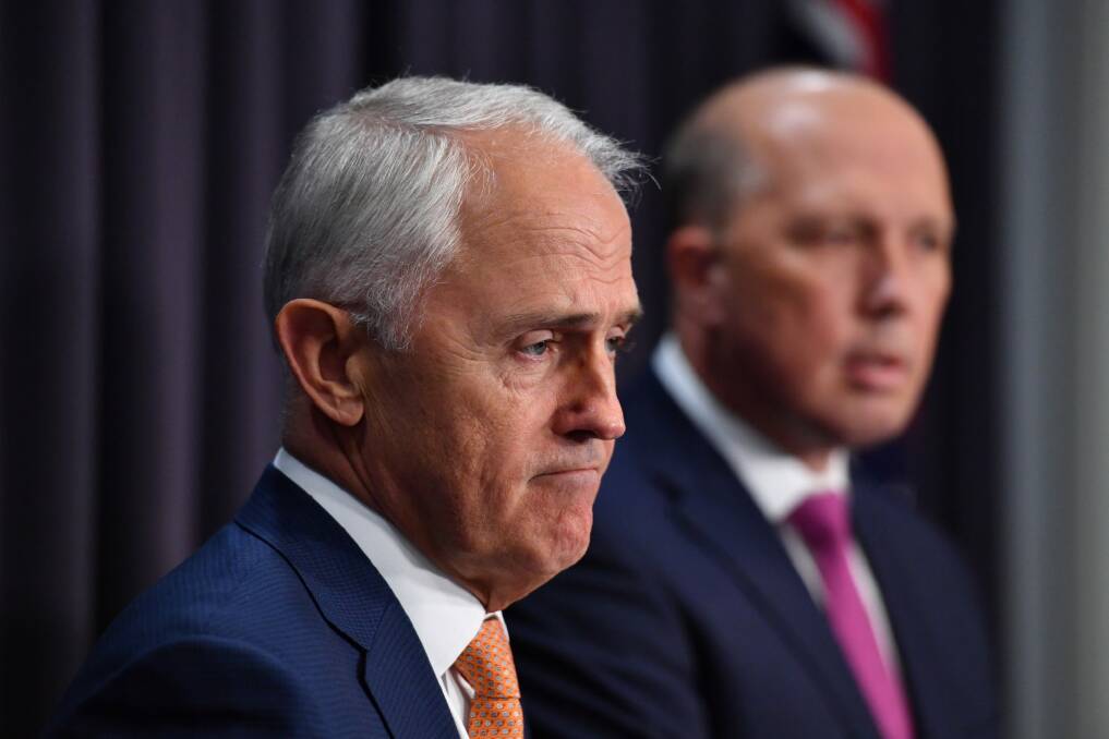 Prime Minister Malcolm Turnbull and Minister for Immigration Peter Dutton at a press conference in Canberra on Monday. Photo: Mick Tsikas