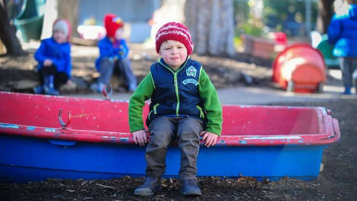Rugged-up Finn Conlan isn?t exactly a picture of enthusiasm during outside playtime at Blue Gum Preschool. Photo: Katheirne Griffiths