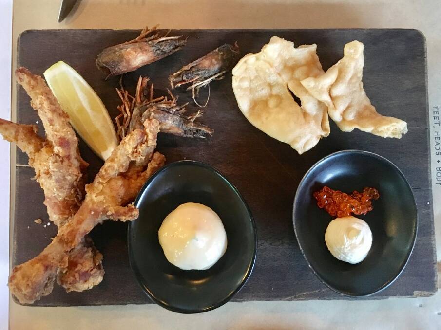 The entree plate with deep fried chicken feet, prawn heads and trout roe.  Photo: Jil Hogan