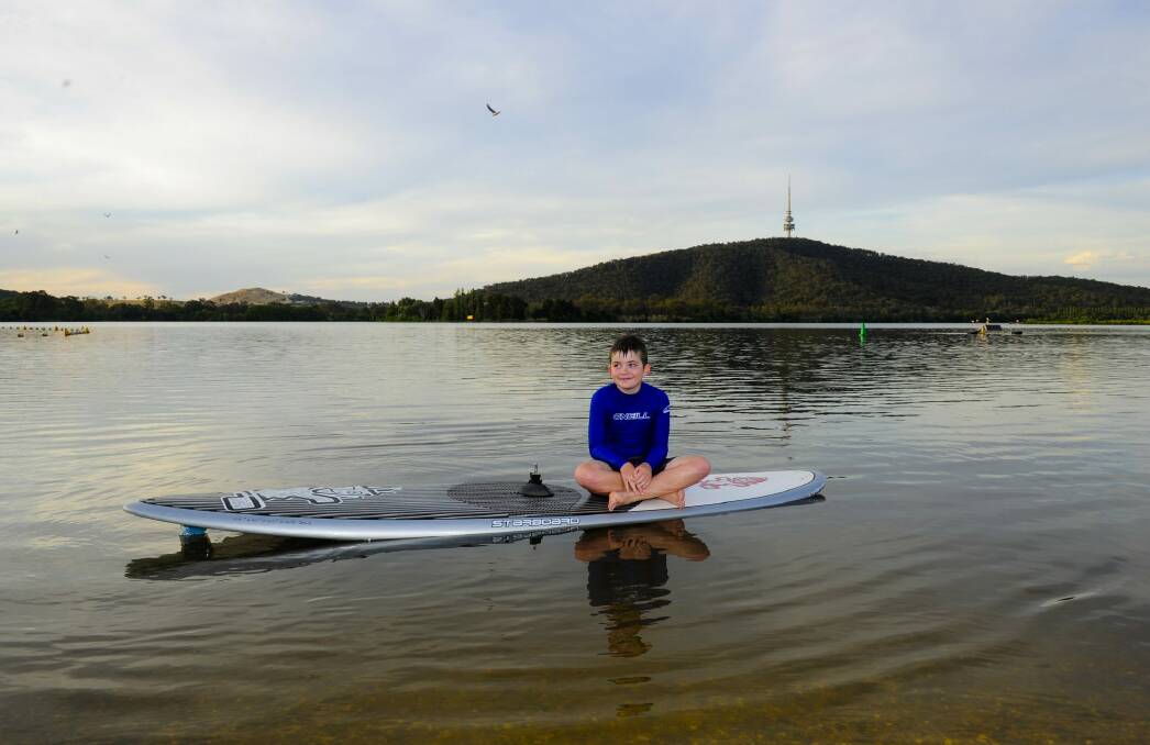 At ease: Matthew Shea,10, of Mawson, relaxes on Lake Burley Griffin. Photo: Melissa Adams