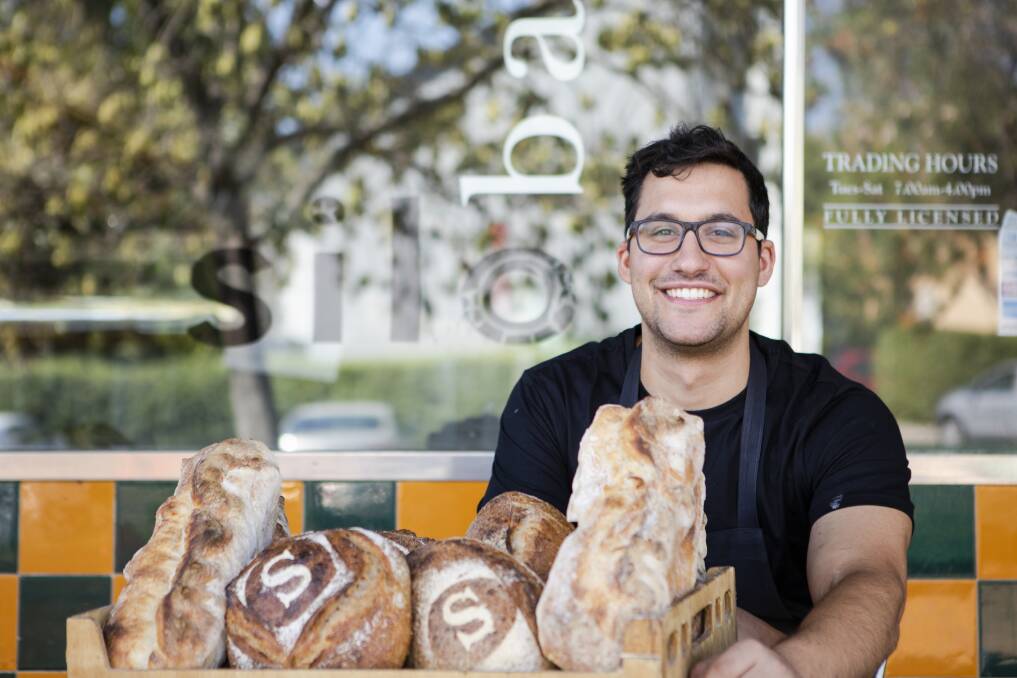 Silo Bakery manager Aidan Fallace with bread outside the Kingston bakery. In the final quarter of 2018, bread was 7.9 per cent cheaper on average in Canberra than it was in mid-2011. Photo: Jamila Toderas