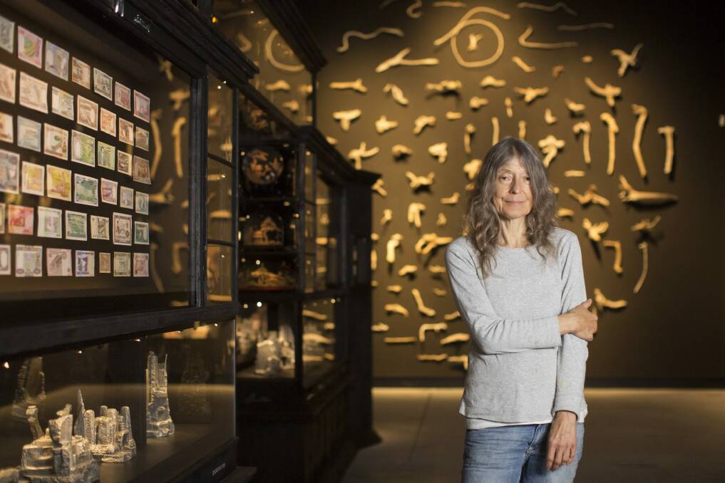 Hall with her series of painted banknotes Leaflitter. Photo: Angus Mordant