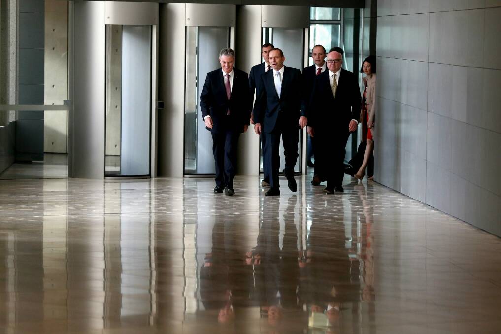 ASIO director-general of security Duncan Lewis, Justice Minister Michael Keenan, Prime Minister Tony Abbott, Immigration Minister Peter Dutton and Attorney-General Senator George Brandis during their visit to the ASIO headquarters in Canberra. Photo: Alex Ellinghausen