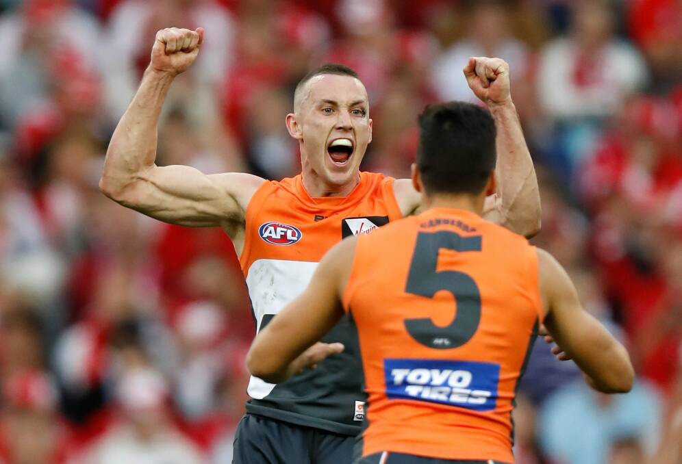 Maiden win: Tom Scully and Dylan Shiel celebrate during the 2016 AFL First Qualifying Final match between the Sydney Swans and the GWS Giants at ANZ Stadium. Photo: Getty Images