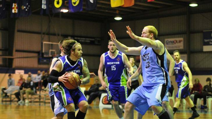 Norths player Andrew Martin and Wests player Chris Hartmann in action in the grand final. Photo: Melissa Adams