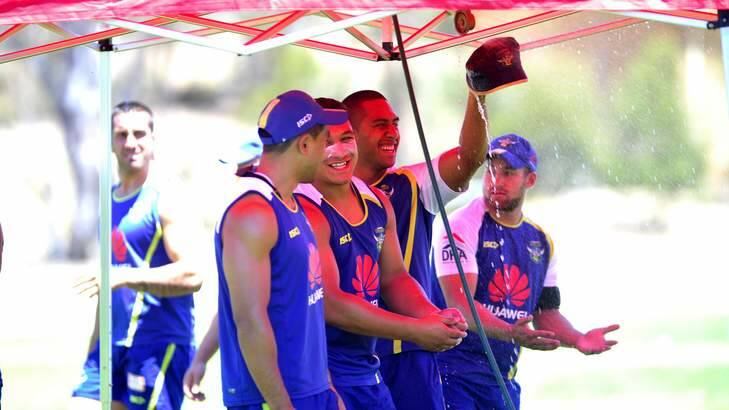 Raiders players try to keep cool during training on Thursday with their shower tent. Photo: Melissa Adams