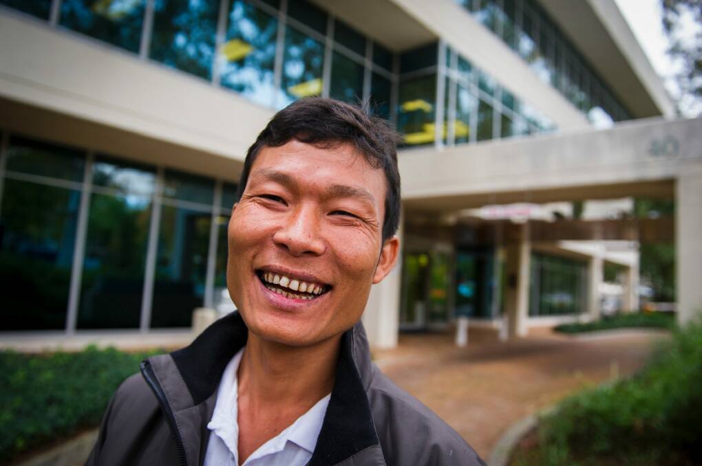 ACT school cleaner Htoo Ywai was happy with Friday's result and thanked the union for its support during a two-year legal battle.  Photo: Dion Georgopoulos