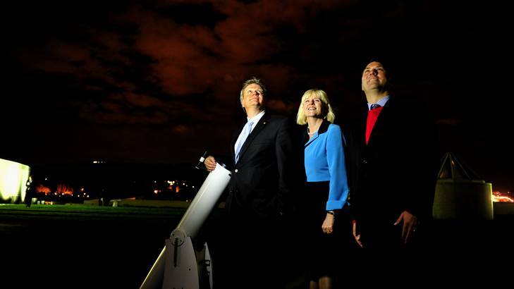 Professor Brian Schmidt on the roof of Parliament House with MPs Karen Andrews and Richard Marles last night at an event hosted by the Parliamentary Friends of Science. Photo: Melissa Adams