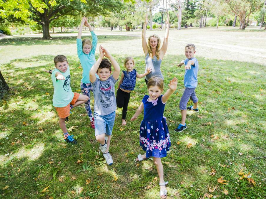 Blue Gum School at Hackett provides yoga classes for children. (Front from left), Toby Felton-McMahn, 7, and Lara Barnes 5. (behind from left), Sam Inglis 12, Ruby Martyn 11, Matilda Davies, 5, After School Care Coordinator Ruth Pickard, and Max Barnes, 9. Photo:  Jamila Toderas