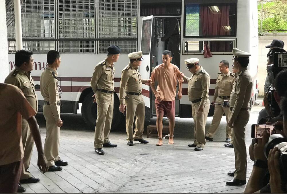 Hakeem Al-Araibi arrives at the Bangkok court on Monday with his legs shackled. Photo: James Massola