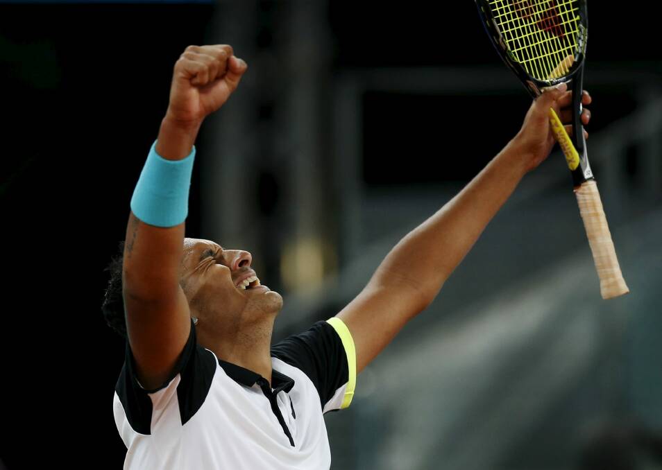 Kyrgios celebrates his victory over Federer at the Madrid Open. Photo: Reuters